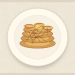 Apple cinnamon skillet pancakes stacked with soft apple slices and honey drizzle.