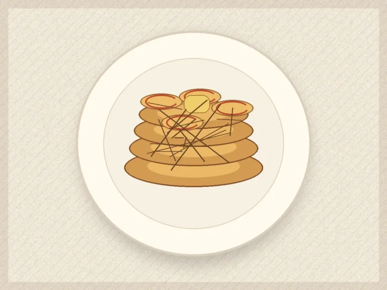 Apple cinnamon skillet pancakes stacked with soft apple slices and honey drizzle.