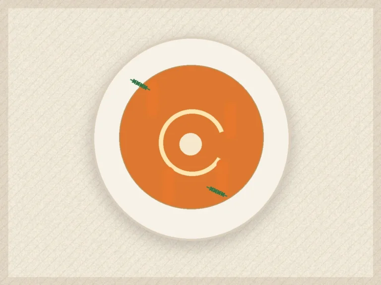 Smooth roasted carrot lentil soup with yogurt swirl, cumin, and toasted seeds.